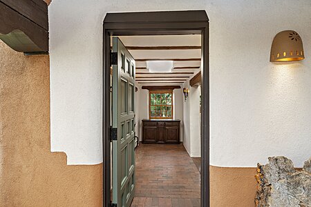 Front door to brick paved Foyer