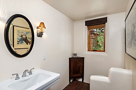 Powder Room is situated between the Dining Room & Kitchen