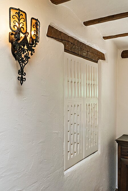 One of two finely detailed Foyer sconces