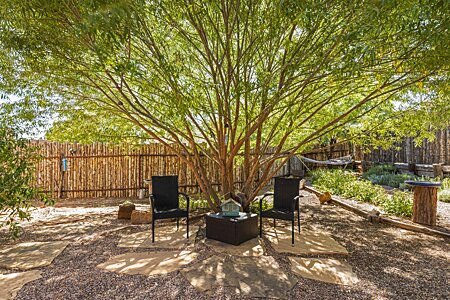 Beautifully landscaped yard with relaxing and conversation spots.