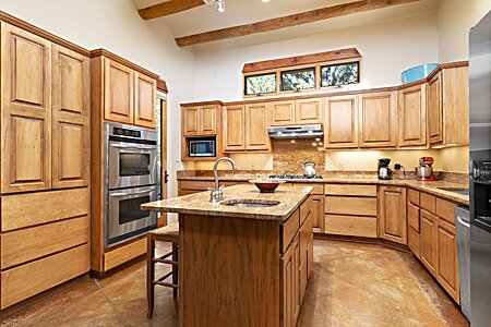 Gourmet Kitchen with Stainless Steel upgraded appliances with granite counters.