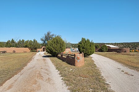 Circular driveway entrance, barn is to the right