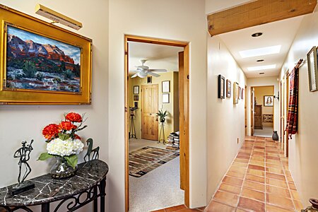 Hallway to guest bedrooms, office entrance on the left