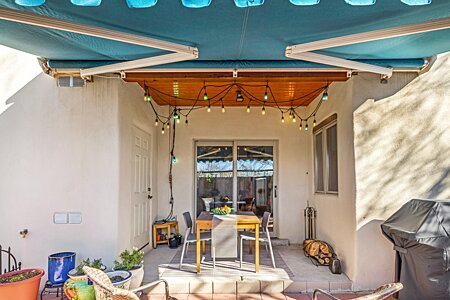 Very fun covered back portal with extendable/retractable awning