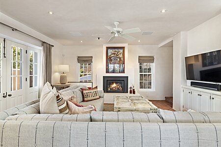 Family Room has a GAS Fireplace and French Doors to Private Portal and Walled Garden...