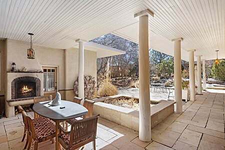 Outdoor dining area and fireplace. 