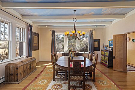Formal dining room has great light, custom painted ceiling, and a fireplace.