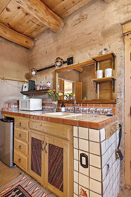 Kitchenette by bedrooms and closer to Studio and walled courtyard for gilling and Barbecuing