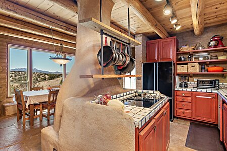 Open Kitchen to informal dining with stunning views down canyon