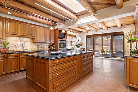 Kitchen features Abundant Cabinets, Granite Countertops...