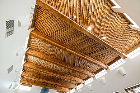 Ceiling detail of hand carved beams and Aspen Latillas