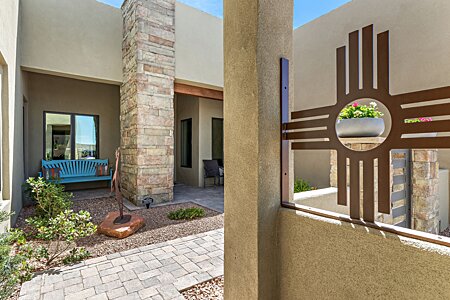 Handmade iron Zia symbol stays with the property along with the Apache Crown Dancer sculpture!