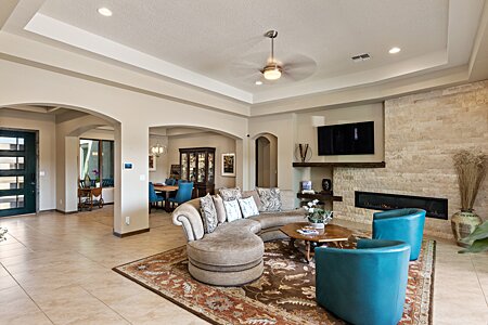 The space: Natural stone walls; creamy high, double tray ceilings; open, airy ambiance 