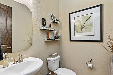 Your guests don't have to use a bedroom's bathroom! Designated powder room.