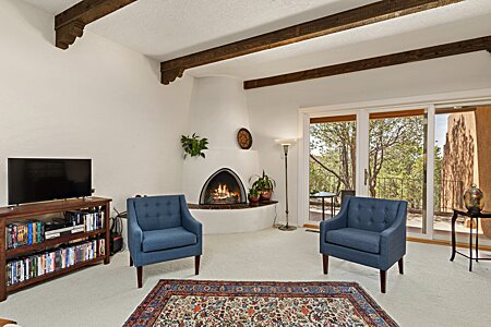 Living room with Kiva fireplace and opens to Deck