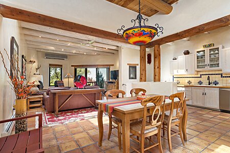 Open great room with Dining, Kitchen and Living room which opens on to sitting Deck with Views over Santa Fe