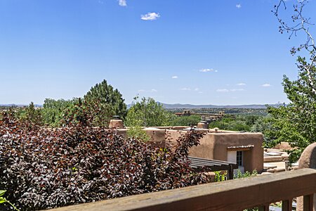 View over downtown Santa Fe, over to the Jemez Mountain range with will provide dramatic sunsets and evening night lights