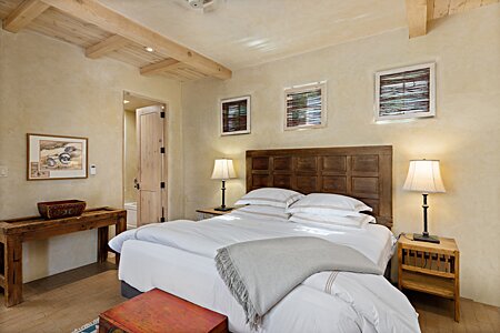 The main bedroom has high ceilings, beautiful pleastered walls, privately set away