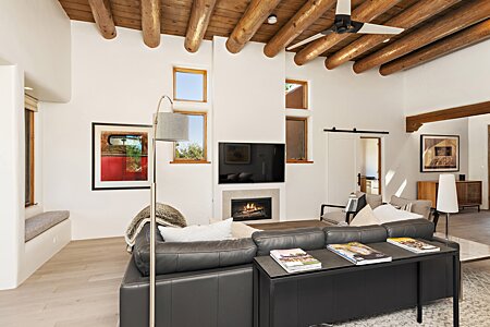 Modernized fireplace, high ceilings and bancos