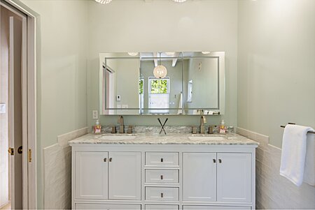 Imagine getting ready in this elegant Marble primary bathroom