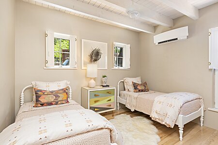 Bedroom number two is spacious, comfortable, bright, and cheery!