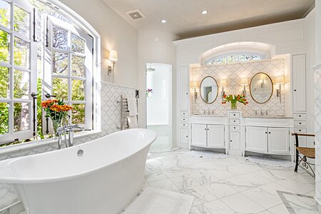 Luxurious Primary Bath has Marble Appointments, ...