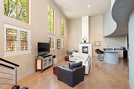 High ceilings, restful curves, stunning plaster and polished concrete floors!