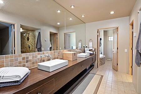 Elegant, high style marble primary bathroom