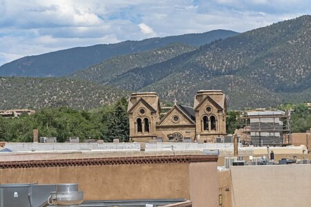The cathedral and the Sangres from the rooftop