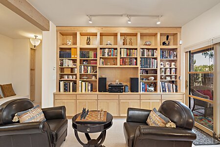 Downstairs Study/Den/TV/Library room opens to Portal and backyard