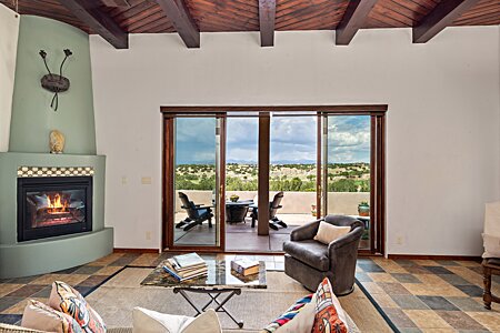 Living Room, showing the Gas Log Fireplace & sliding door to the Golf / Jemez View