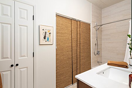 Newly remodeled bathroom with large reach-in closet