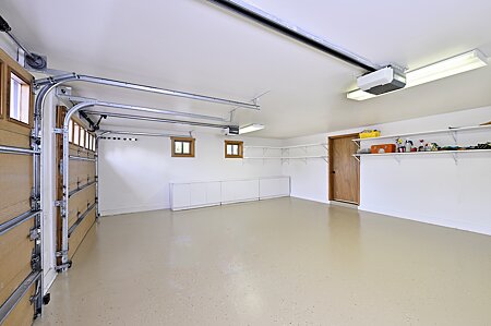 Garage, w/ New Epoxy floor & door to Storage Room