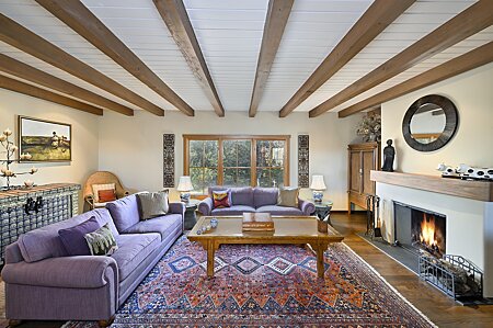 Formal Living Room w/ wood-burning Fireplace plus wood beam ceiling