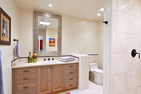 Bathroom Three with ample counter space,  skylight & shower 