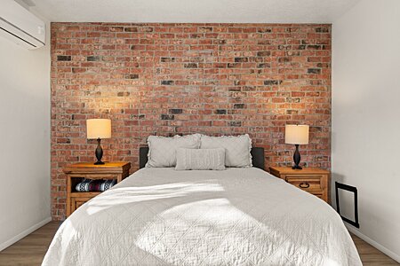 Brick accent wall in Primary bedroom