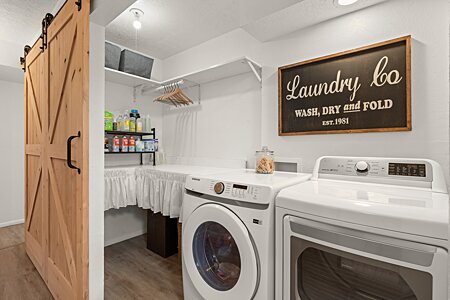 Large Laundry room with custom made Barn Door
