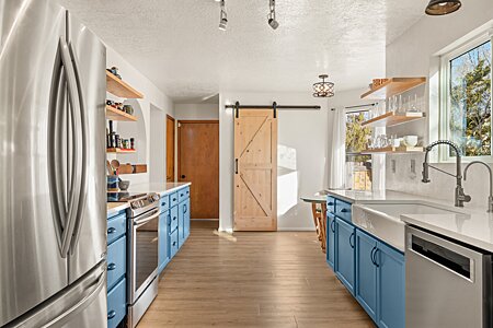 Great upgraded remodeled Kitchen with a walk in Pantry behind the Barn door