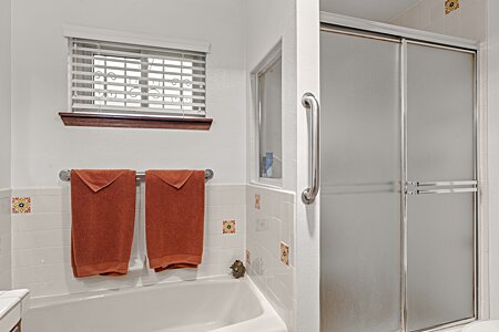Primary bathroom with both tub and walk in shower
