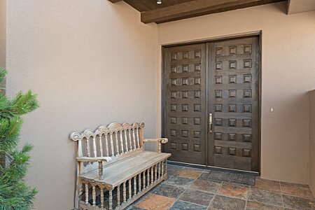Handmade double doors welcome your guests.
