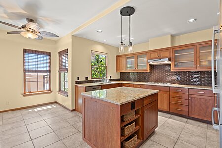 Open and bright Kitchen with comfortable casual space to visit as the Chef prepares the meal