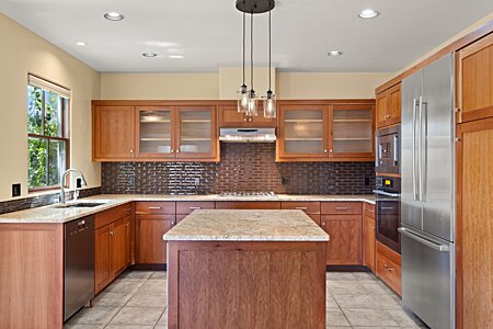 Beautiful Kitchen with Cherry Cabinets and Viking, Bosh, Miele Stainless Steel appliances