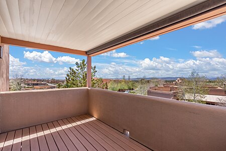 Viewing deck off of primary bedroom upstairs looking South-West to the Sandia Mountain