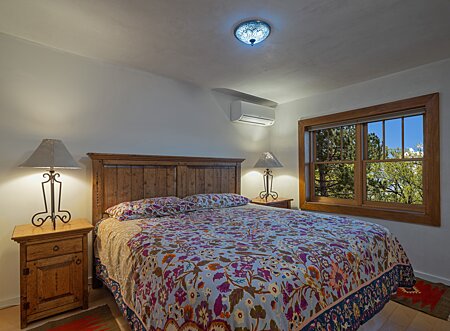 The Bedroom accommodates a king-sized bed with nightstands. 