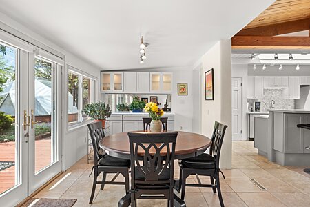 Dining Area with French Doors to Back Yard and easy access to Kitchen