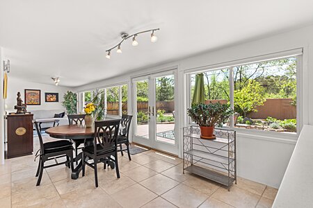 Dining Area and Sunroom with windows and French Doors to back yard
