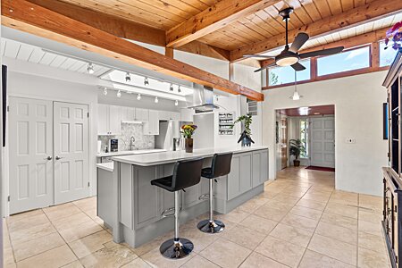 Modern, remodeled Kitchen with wood beamed ceiling