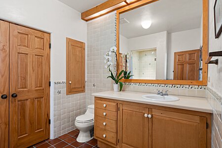 Clean, fresh and cheerful Talavera tile guest bathroom