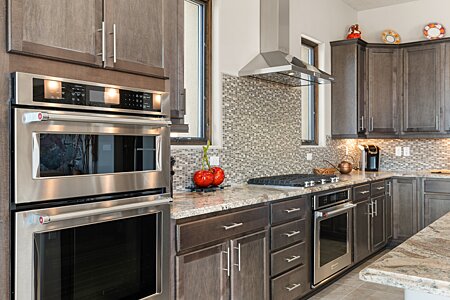 Chef's Kitchen features two ovens, 5-burner cooktop and microwave 