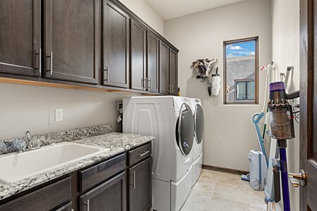 Laundry Room with deep sink & wall of cabinets